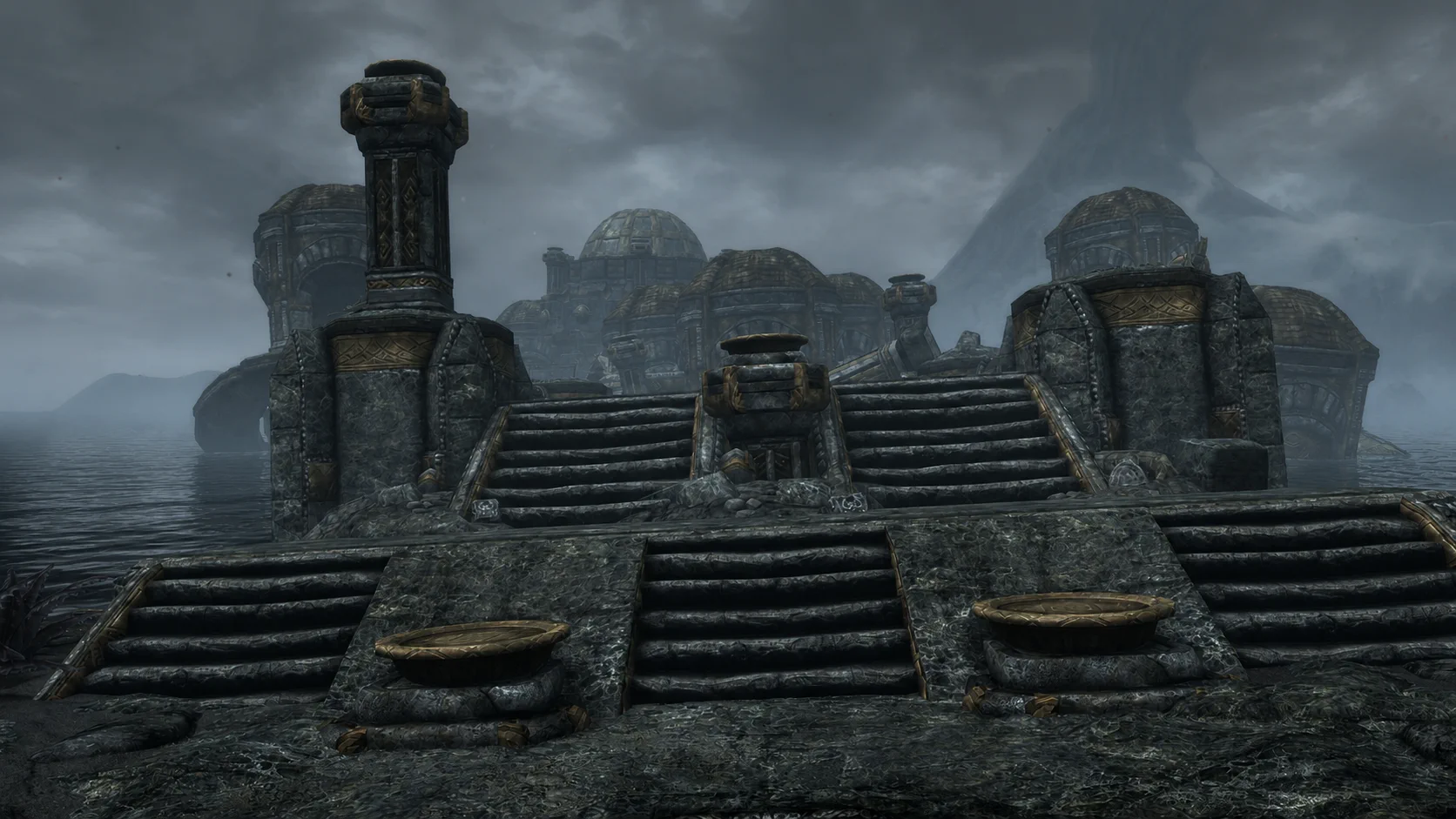 The flooded Dwemer ruins of Nchardak beneath a foggy Solstheim sky
