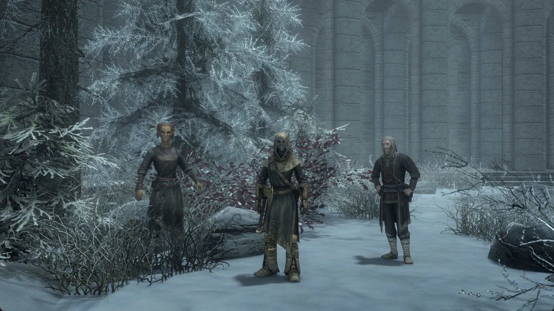 The Dwemer Seeker assembled with two College mages in a snow-covered courtyard