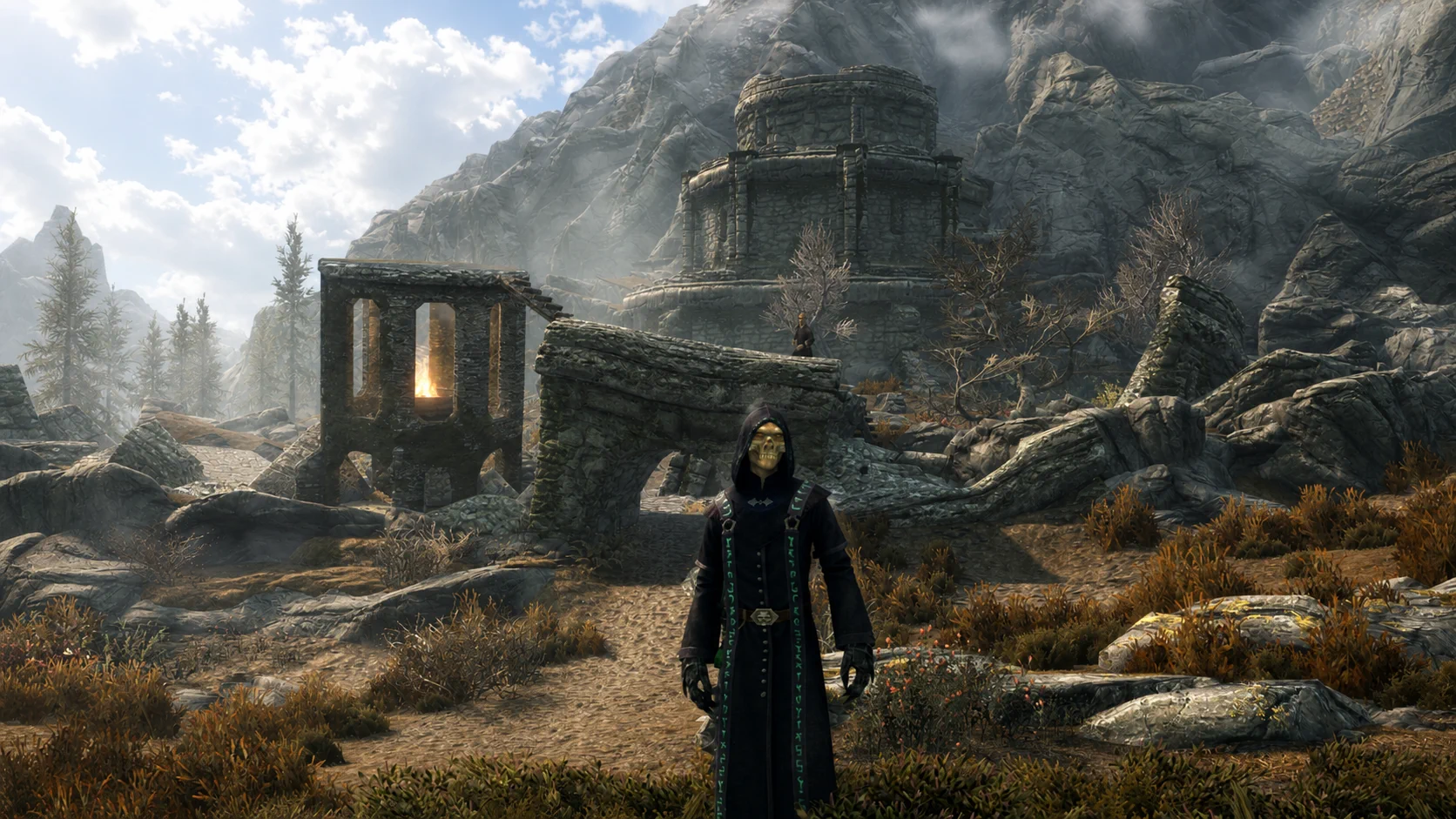 The masked ascendant necromancer standing in rune-trimmed robes before Fellglow Keep