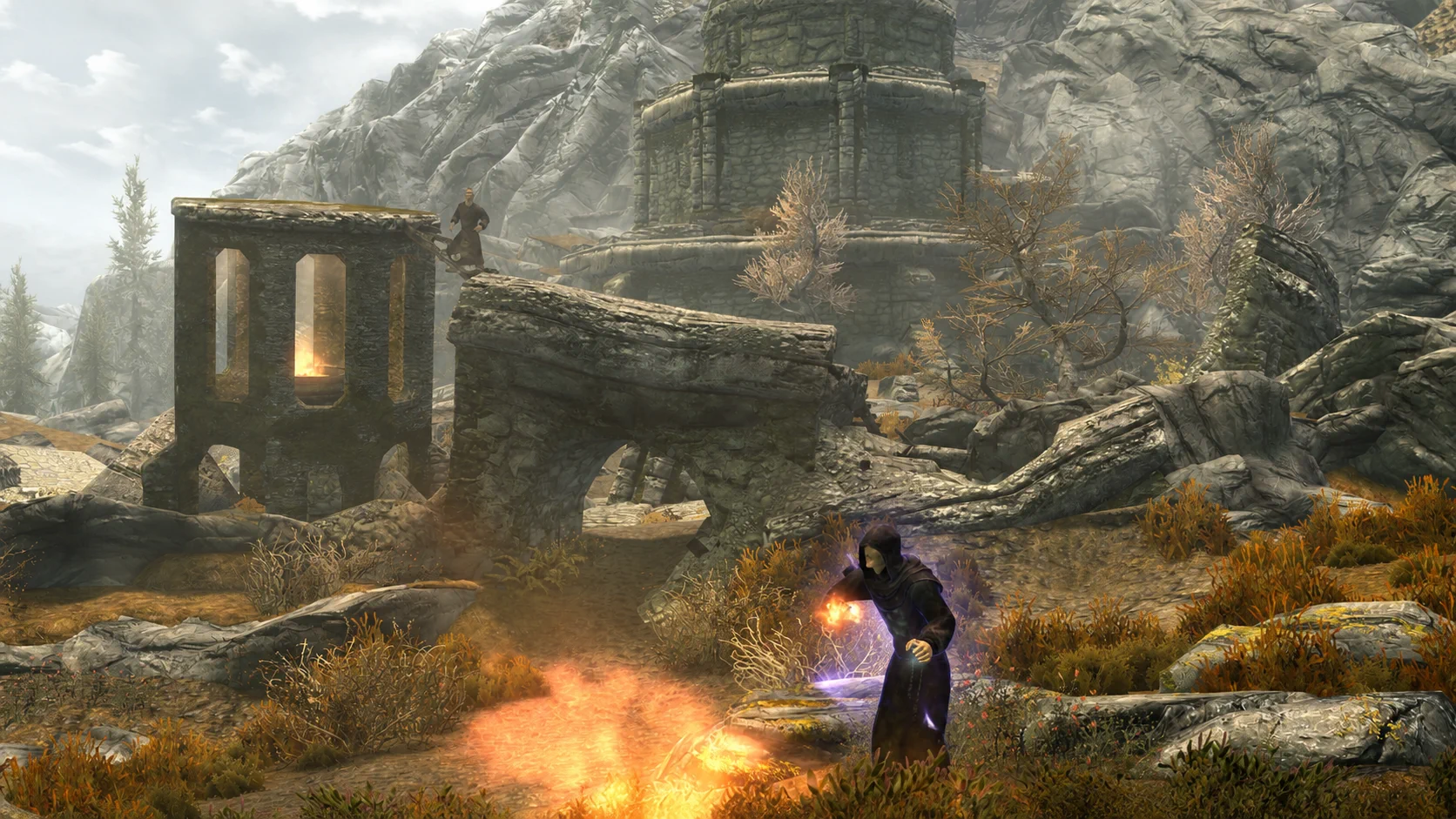 The early necromancer channeling fire and violet summoning magic outside Fellglow Keep