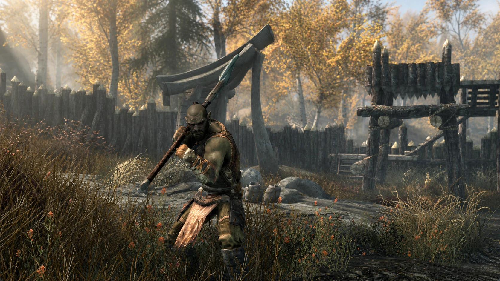 The Stronghold Smith carrying a battleaxe beside the gate at Largashbur