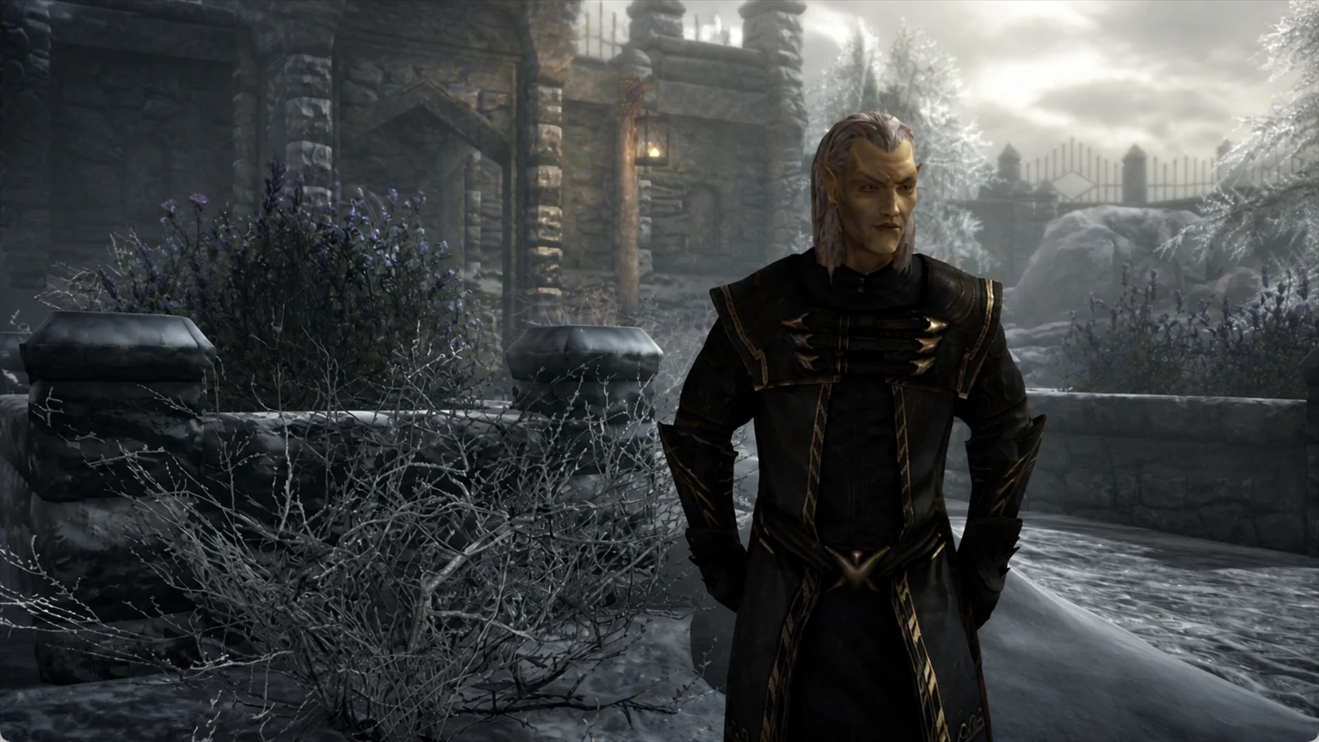 The Thalmor Justiciar standing formally in black-and-gold robes amid the snow-covered embassy grounds