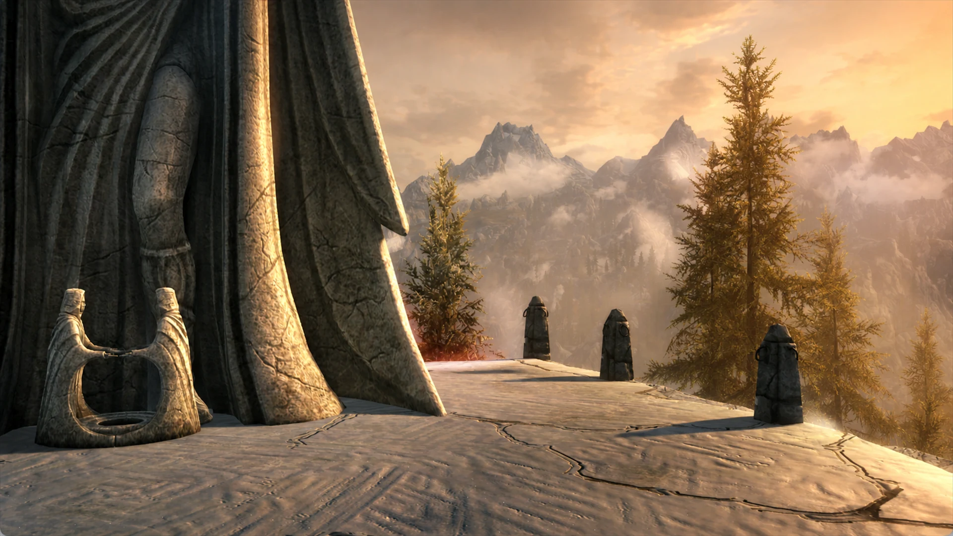 The snowy terrace and standing stones at Kilkreath beneath a golden mountain sky